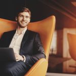 A successful business owner contemplates their next move after securing jumbo loan qualification for a luxury property.